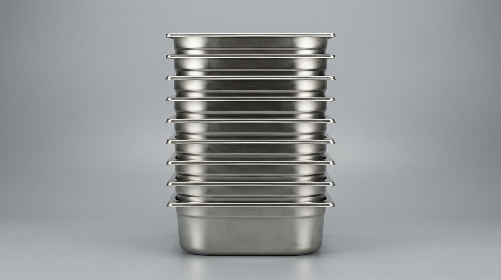 Stainless serving equipment on a studio sweep